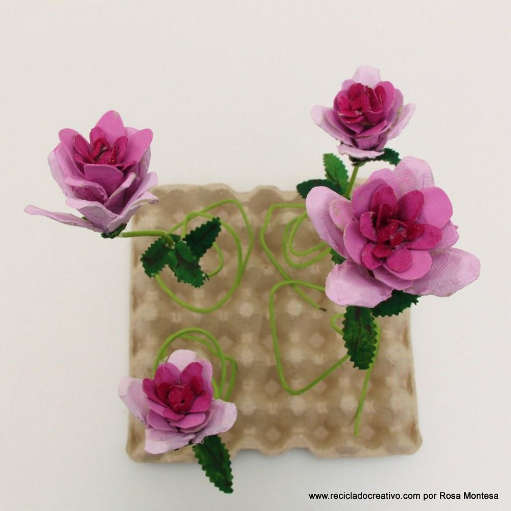 Cómo realizar flores rosas con hueveras de cartón recicladas How to make flowers out fo recycled egg cartons http://youtu.be/8450l1XT6Ww
