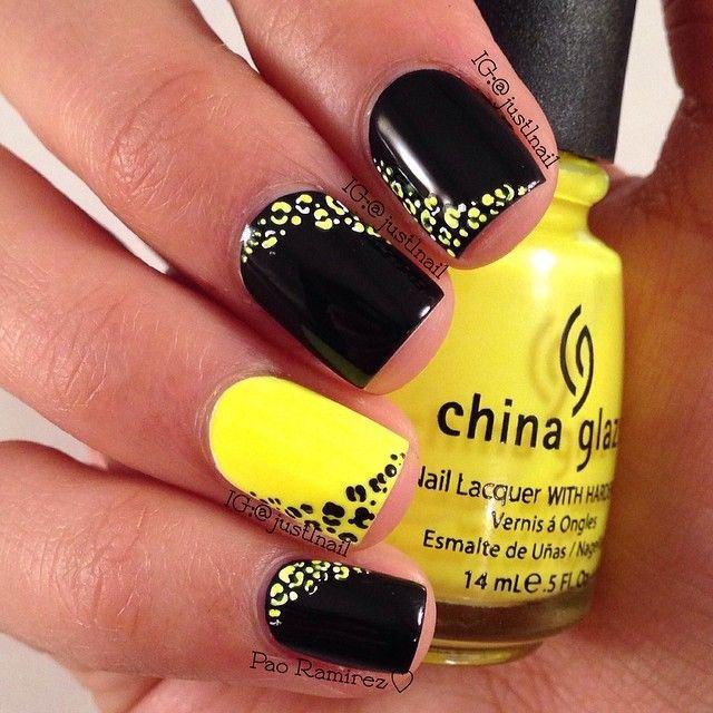 uñas de gel cortas amarillo y negro