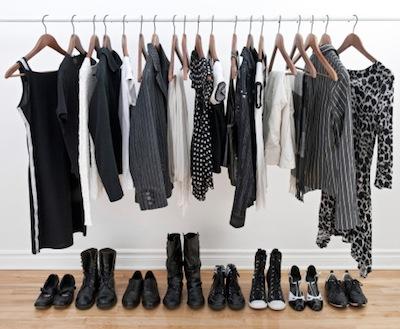 Female clothes on hangers and shoes