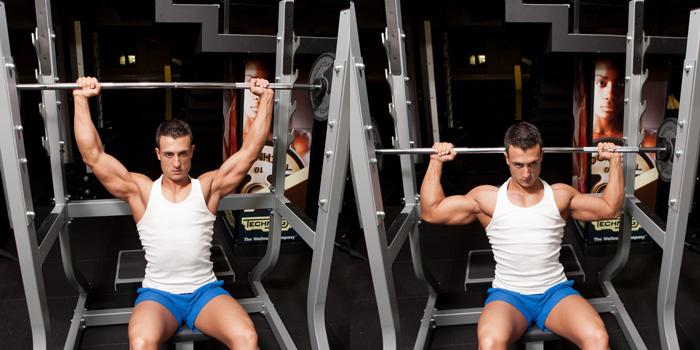 Ejecucion de levantamiento de barra para hombros