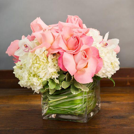 WHITE HYDRANGEA AND PINK ROSES WITH CYMBIDIUM ORCHIDS IN A SQUARE GLASS VASE:
