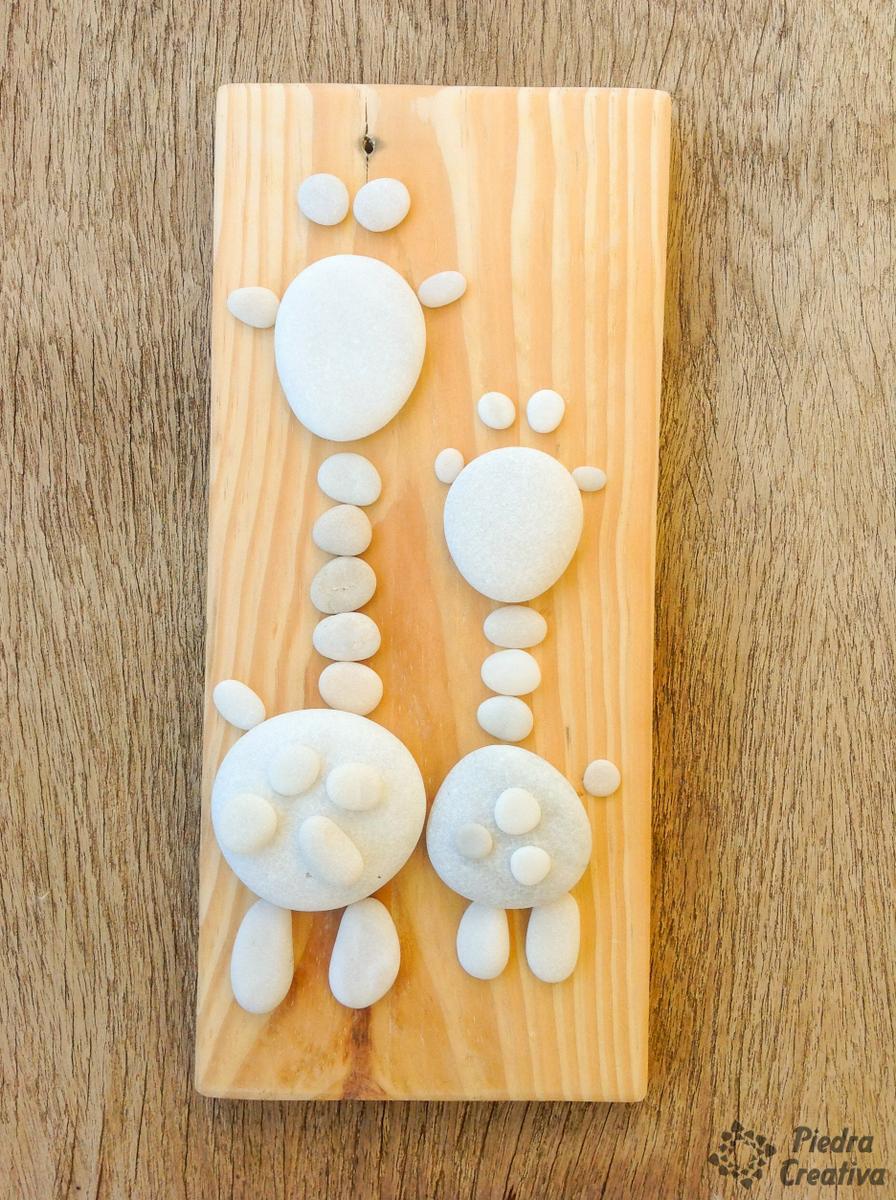 Manualidad de jirafa con piedra pintadas