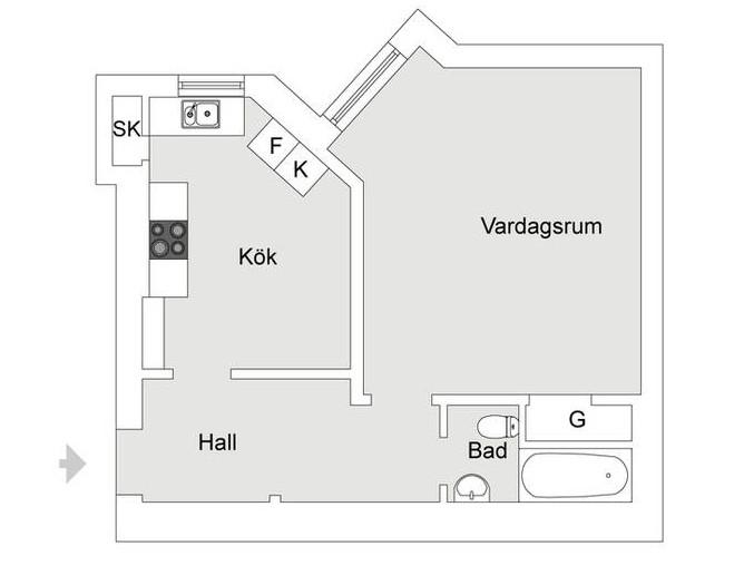 Un apartamento con la cama en un altillo.