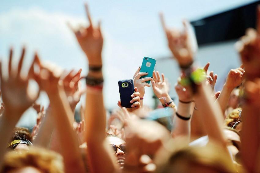 Concert-goers-record-video-and-take-pictures-with-cell-phones