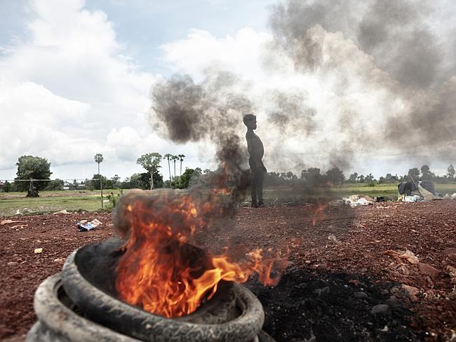 The inhabitants are forced to burn some of the waste. Picture: David Rengel / AnHua