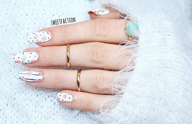 Uñas decoradas con flores vintage sobre fondo blanco