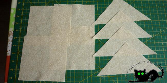 Cortamos los cuadrados y triángulos que usaremos como fondo de la estrella