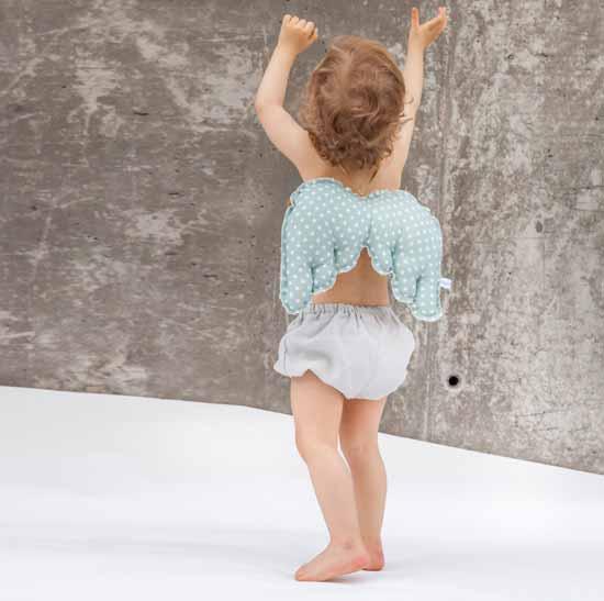 Cojín en forma de alas.