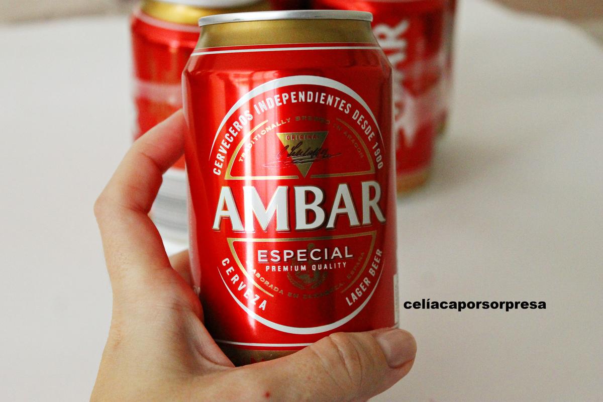 latas-ambar-mano