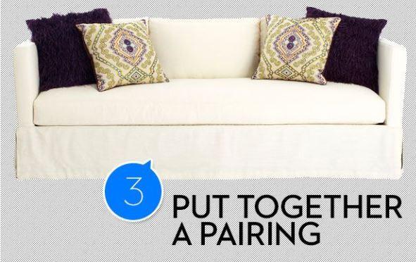 alt="cojines en el sofá"