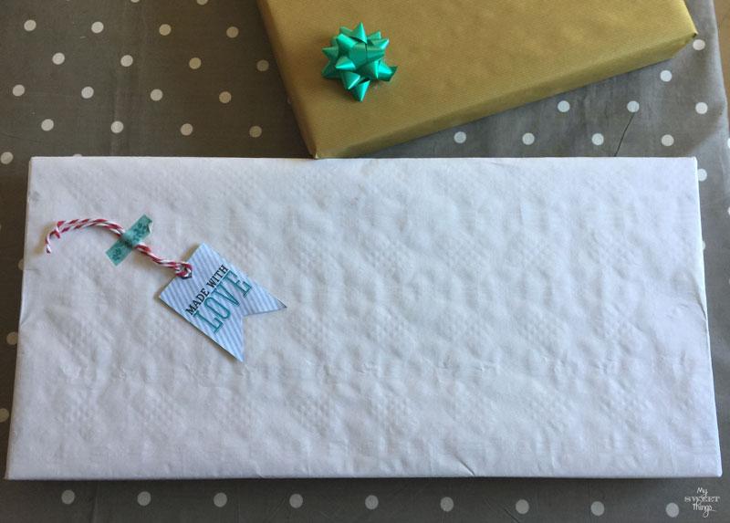 How to make an cool string wall art as a DIY birthday gift using a piece of scrap wood, some yarn and head nails