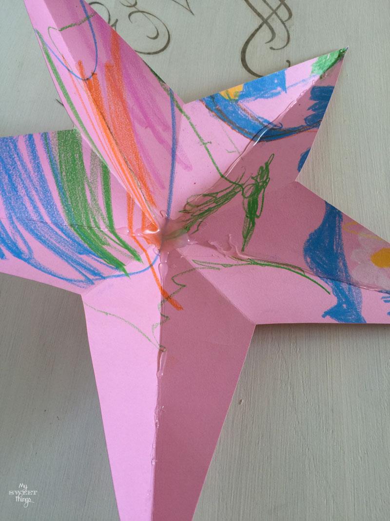 Tutorial on how to make faux metal stars out of common household items and silver spray paint