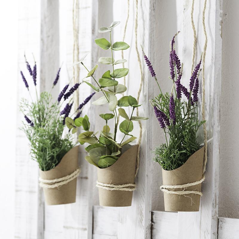 flores artificiales muy mucho tres macetas