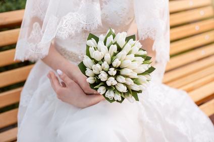 Wedding bouquet in hands of the bride