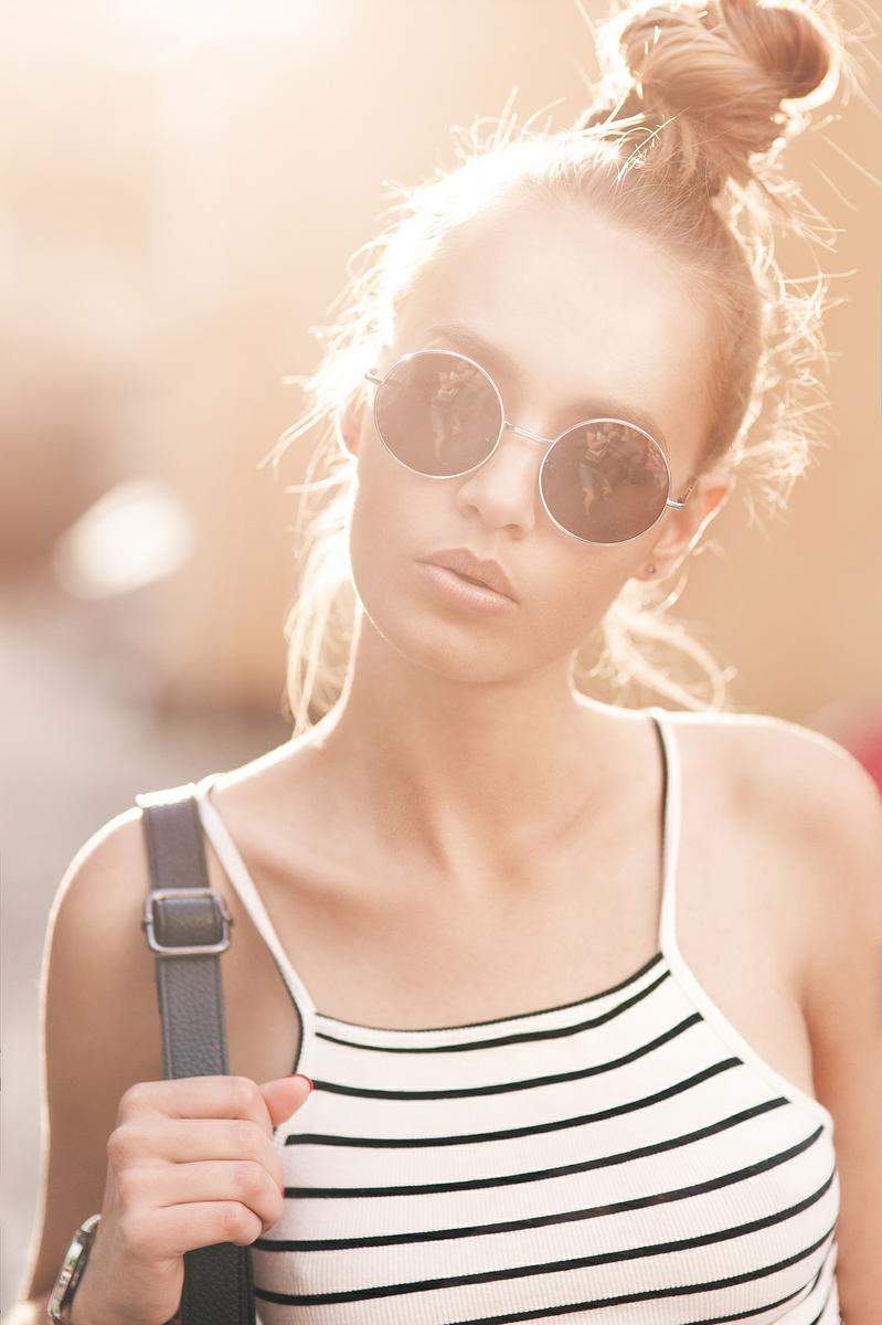 Fashion hipster cool girl in sunglasses.