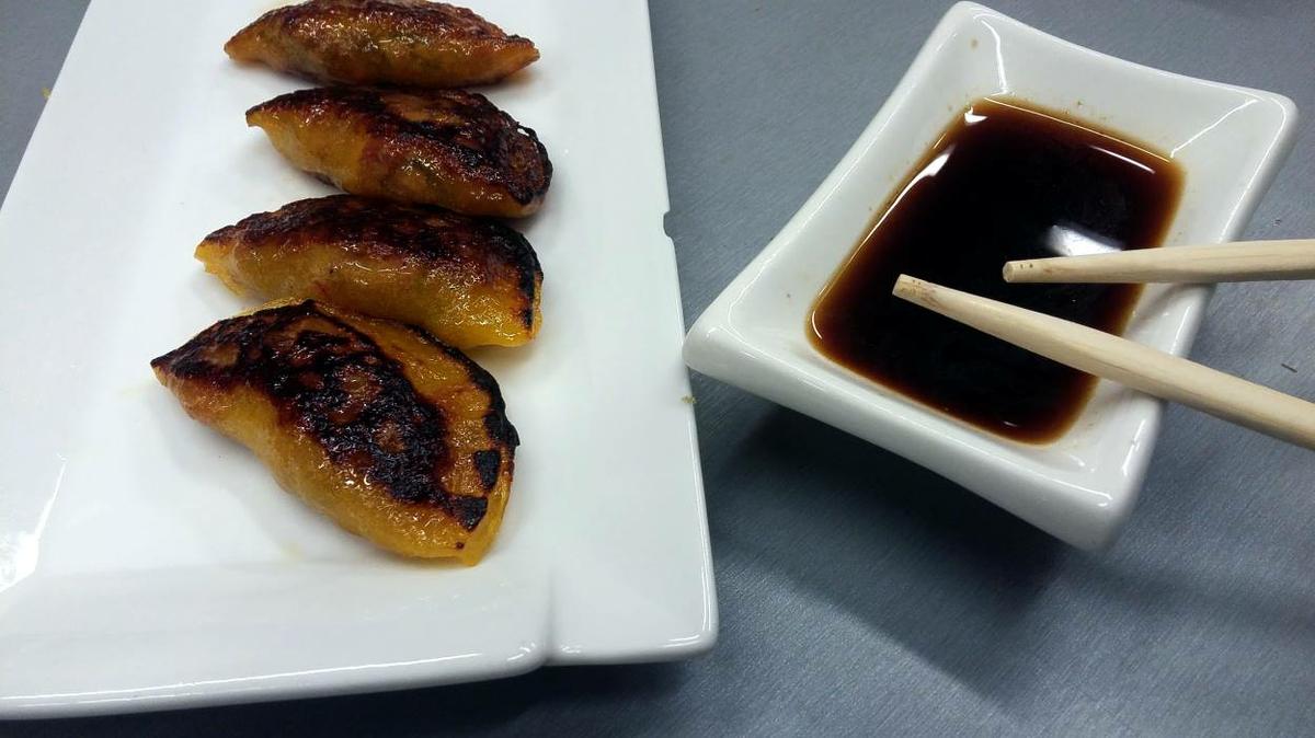 Gyozas de naranja con confit de pato