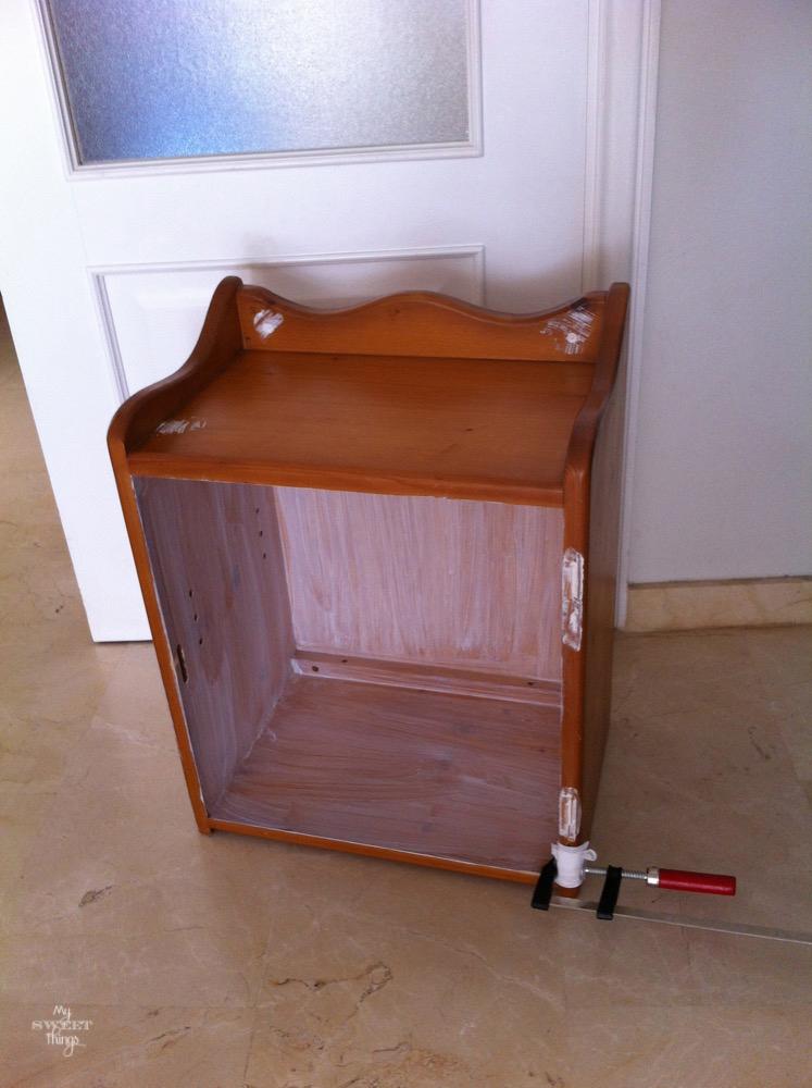 Cabinet found curbside before being transformed into a play kitchen with paint, decoupage and wheels | My Sweet Things