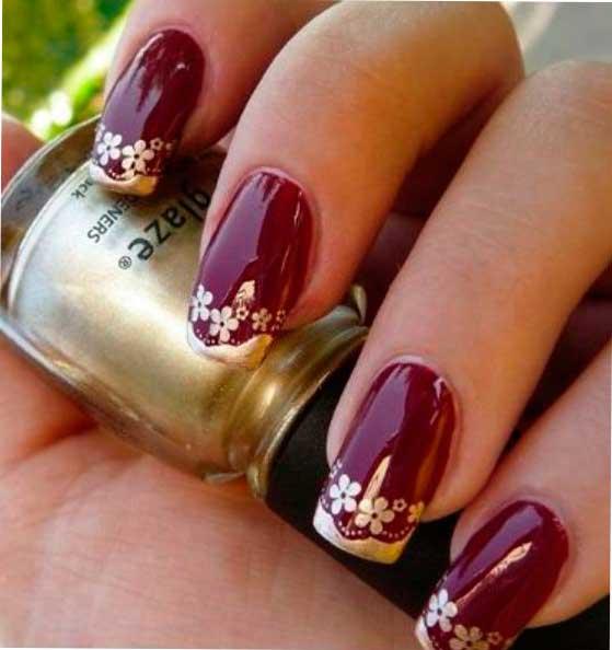 Uñas rojas y doradas