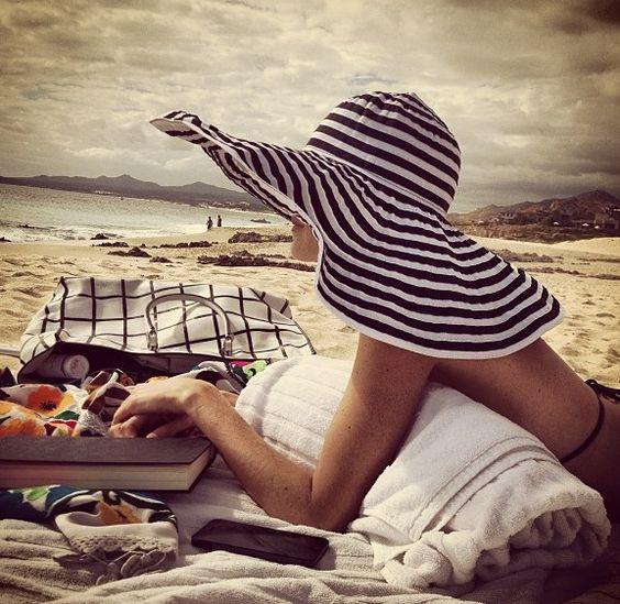 4. Woman in striped black oversize hat