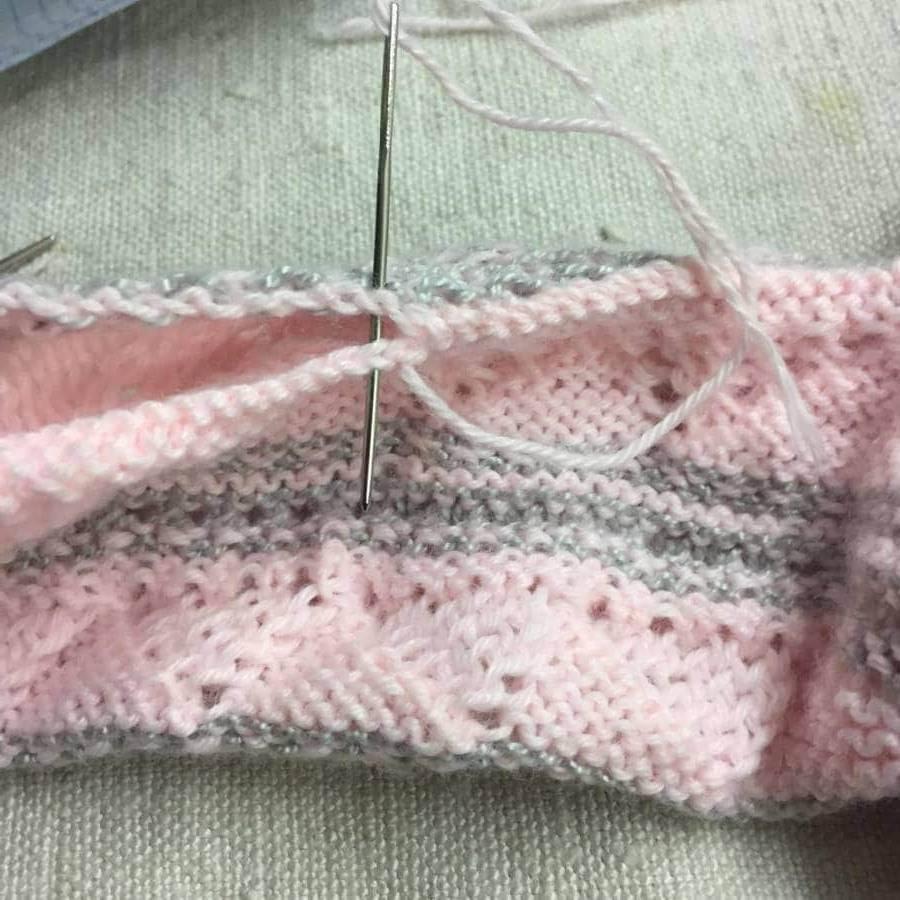 Coser mangas chaqueta de punto