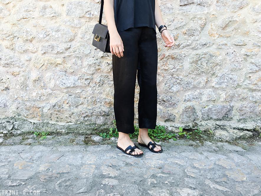 Trini | Acne Studios t-shirt Reformation pants Hermes Oran sandals