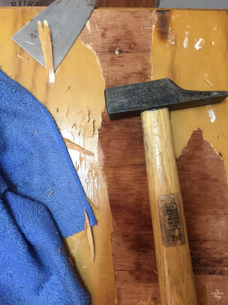 Transform furniture with decoupage and milk paint - A before shot of a nightstand with damaged veneer, stripping it