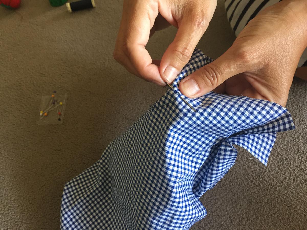 cosemos la tela al vaquero