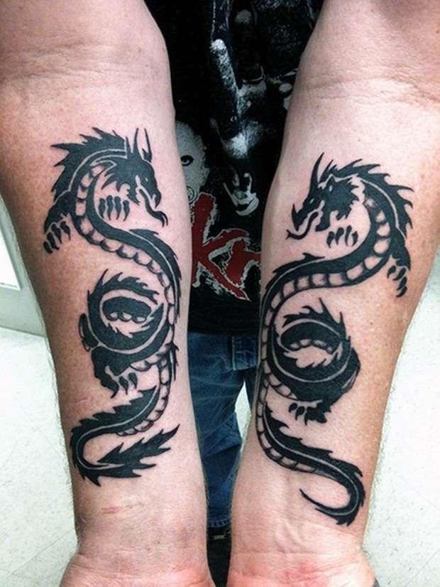 Tatuaje en antebrazo dragones