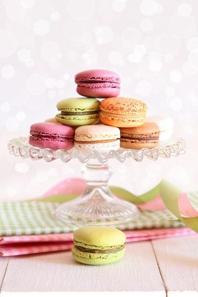 French macaroons on cake tray with vintage background