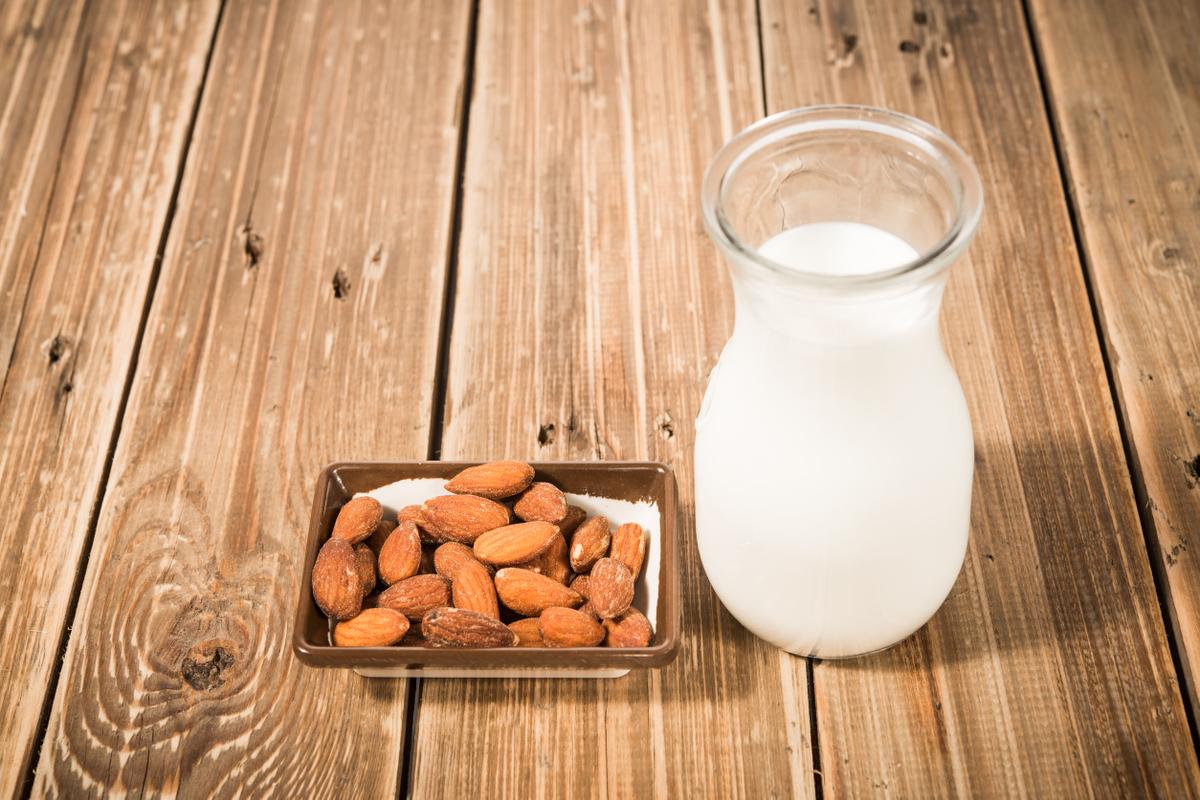 24925988 - almond milk in glass with almonds