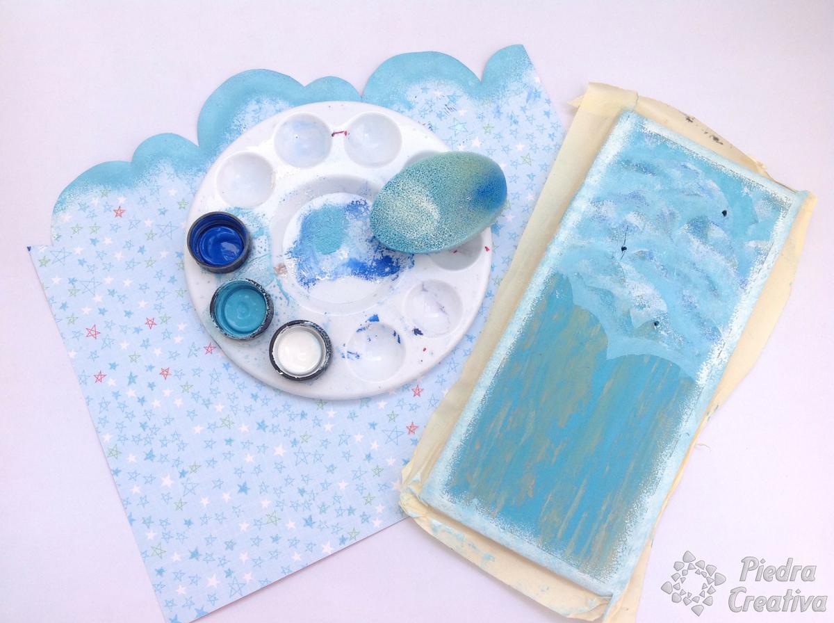 Manualidad de madera para flores con piedras pintadas