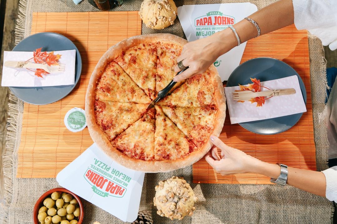 Ración de pizza Papa Jhons Toledo