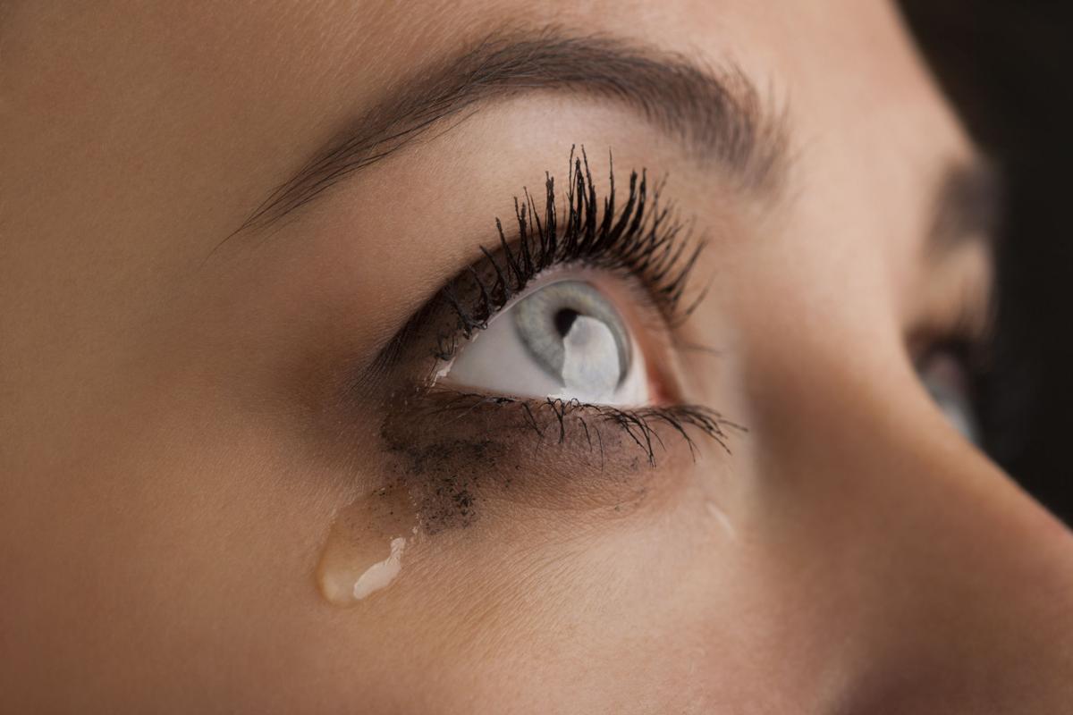 40875622 - beauty girl cry on black background