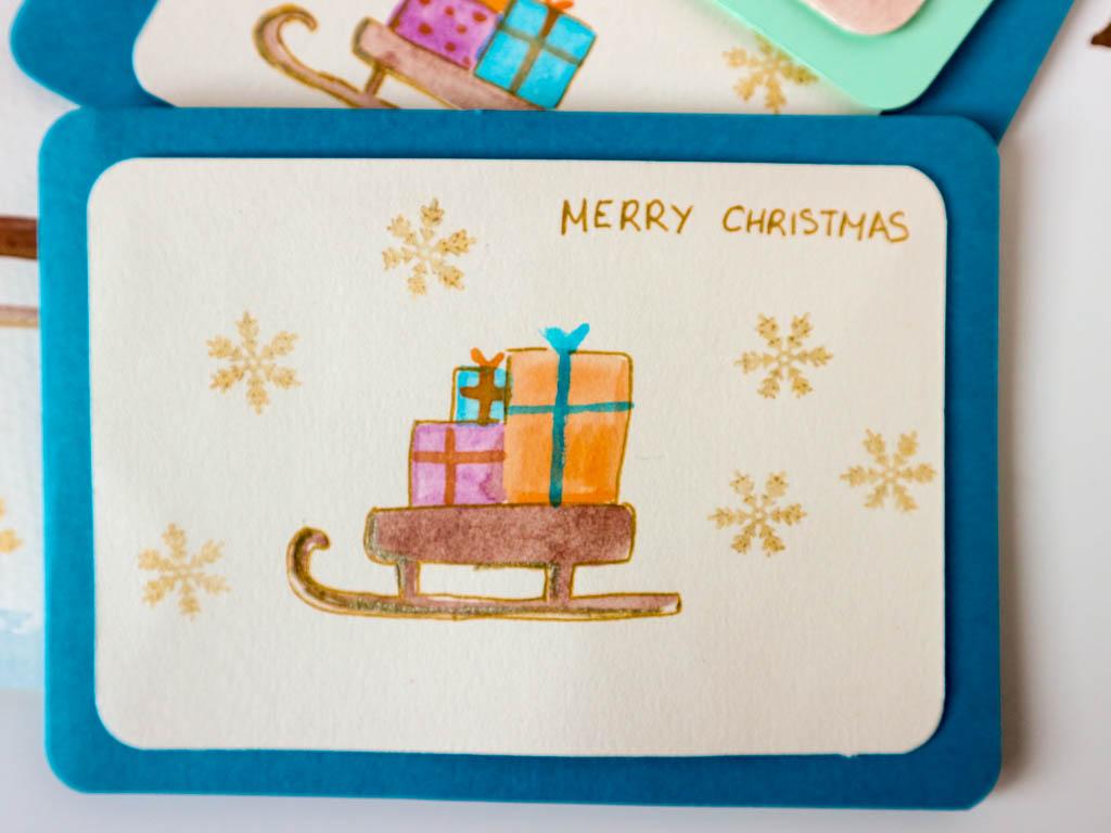 postal de navidad: trineo con regalos