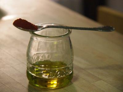 aceite para Timbal de pulpo "A Feira" sobre patata aliñada