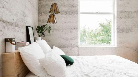 dormitorio con hormigon visto