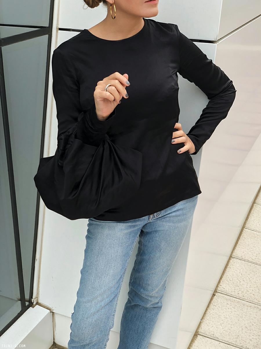 Trini | Acne Studios jeans Deitas top