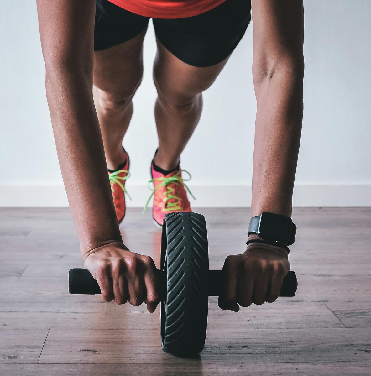 person exercise using roller