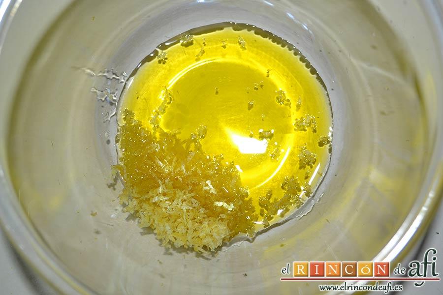 Ensalada de garbanzos, papas, tomates, atún y huevos, poner en un bol aceite, zumo de limón y ralladura de limón