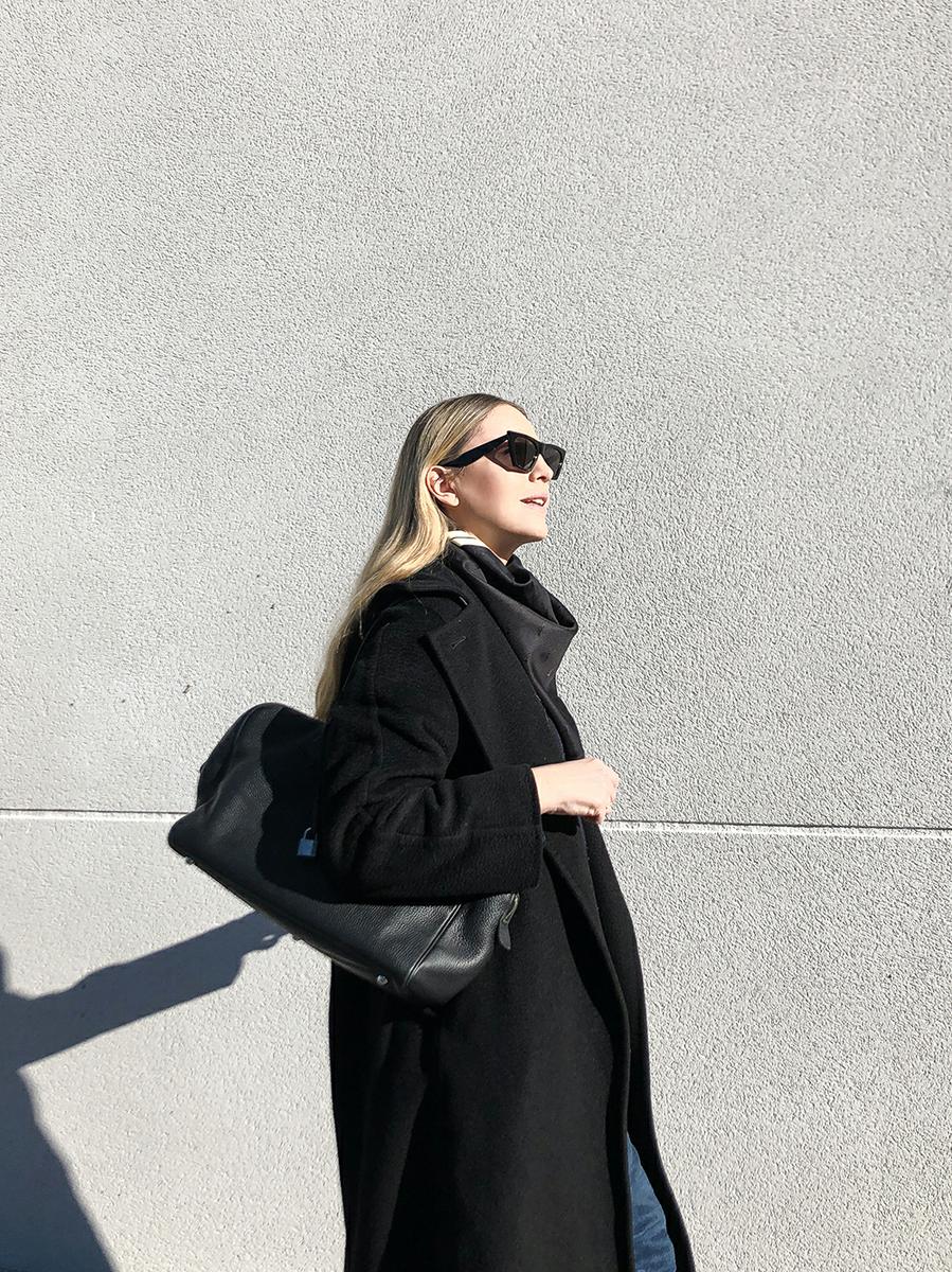 Trini | Max Mara black coat Khaite jeans