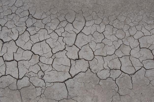 Textura de suelo seco craquelado suciedad fondo de sequía Foto Premium 