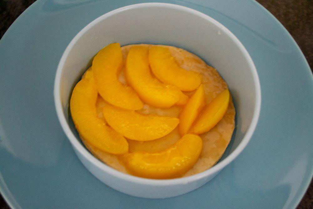 Capa de melocotón en almíbar