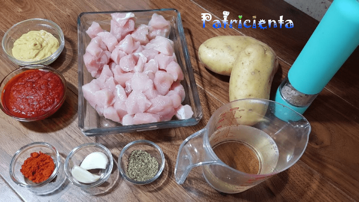 Pollo con patatas en salsa al horno