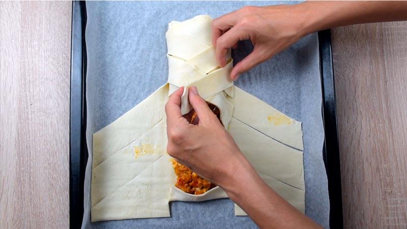 paso a paso dar forma a la trenza de hojaldre rellena de atun y verduras