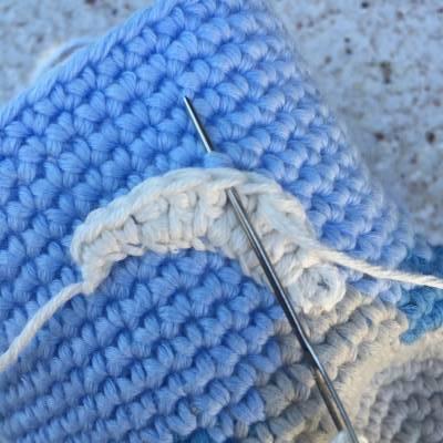 Coser el tronco al monedero crochet isla