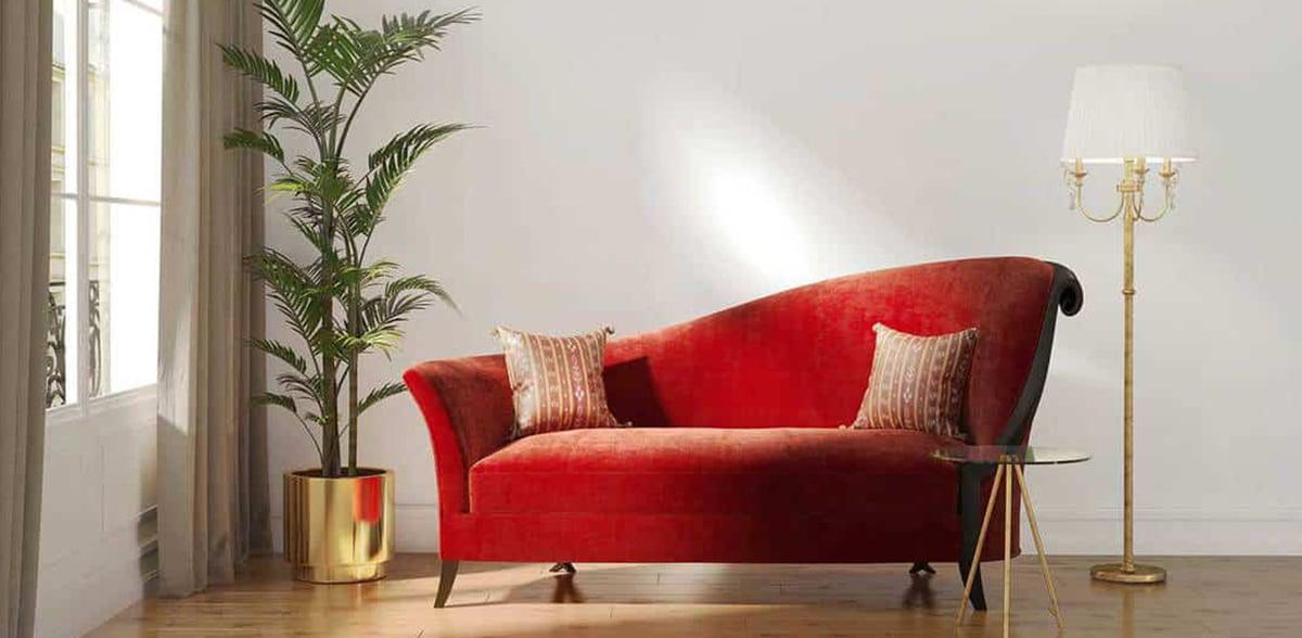 un salón sobrio con sofá rojo