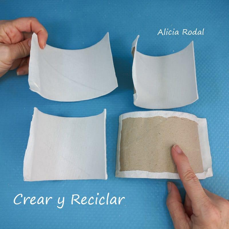 En este tutorial vamos a hacer un organizador vertical con rollos de cartón, telas y otros materiales reciclados. Vamos a darle a este organizador un estilo glamour, con mucho brillo.