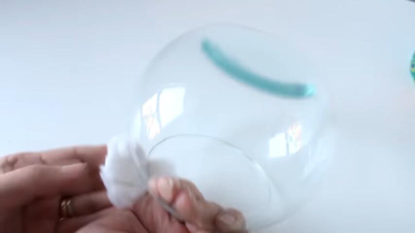 frasco vidrio esfera manos