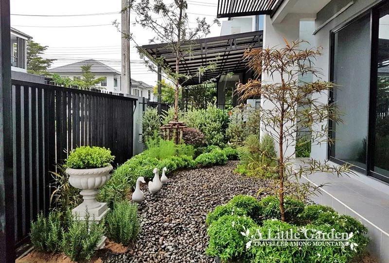 Diseño de entradas principales con plantas y piedras