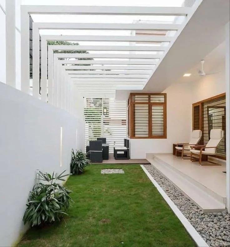 Jardín con pérgola de concreto